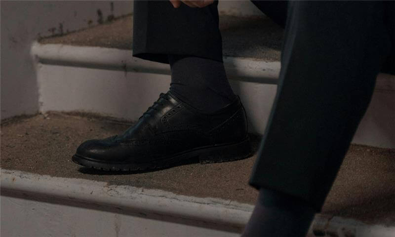 Black dress shoe paired with Lafitte premium business socks 