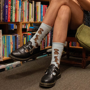 Person wearing Dachshund Crew Socks in light blue and brown cotton